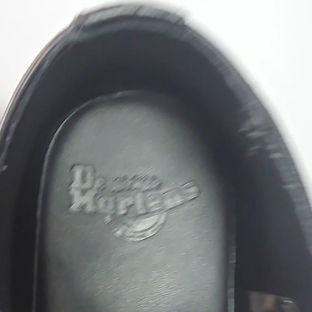Dr. Martens Black Leather Wingtip Oxfords with Yellow Stitching